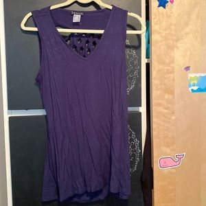Blue flowed shirt with American flag cut out on the back